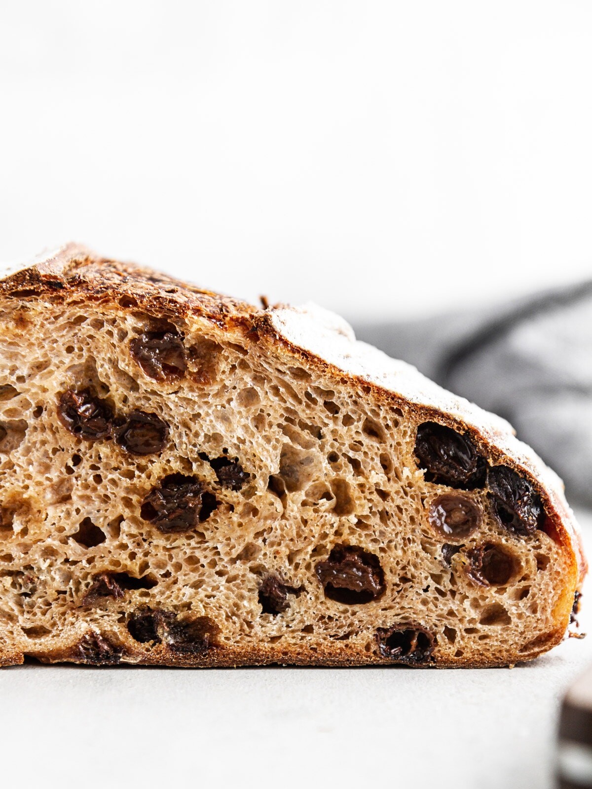 close-up of a slice of cinnamon raisin sourdough bread.