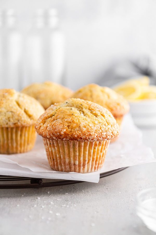 lemon poppy seed muffins on a cooling rack