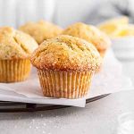 lemon poppy seed muffins on a cooling rack.