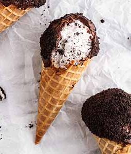 cookies and cream ice cream drumsticks on a surface