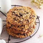 stack of giant oatmeal-raisin cookies on a cooling rack.