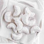 chai-spiced crescent cookies on a plate