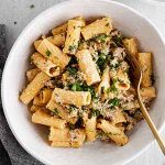 creamy rigatoni with sausage and fennel in a serving bowl.