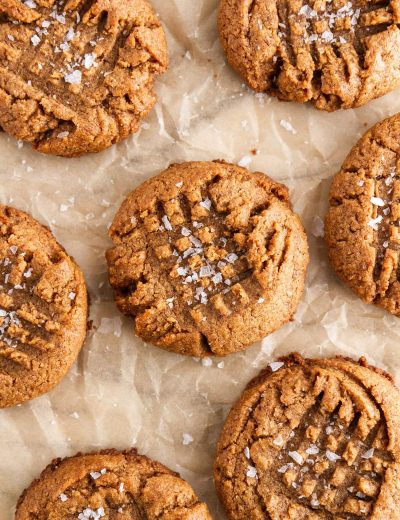 almond butter cookies on a sheet of parchment paper