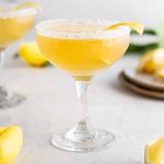 bee's knees cocktail in a coupe glass.