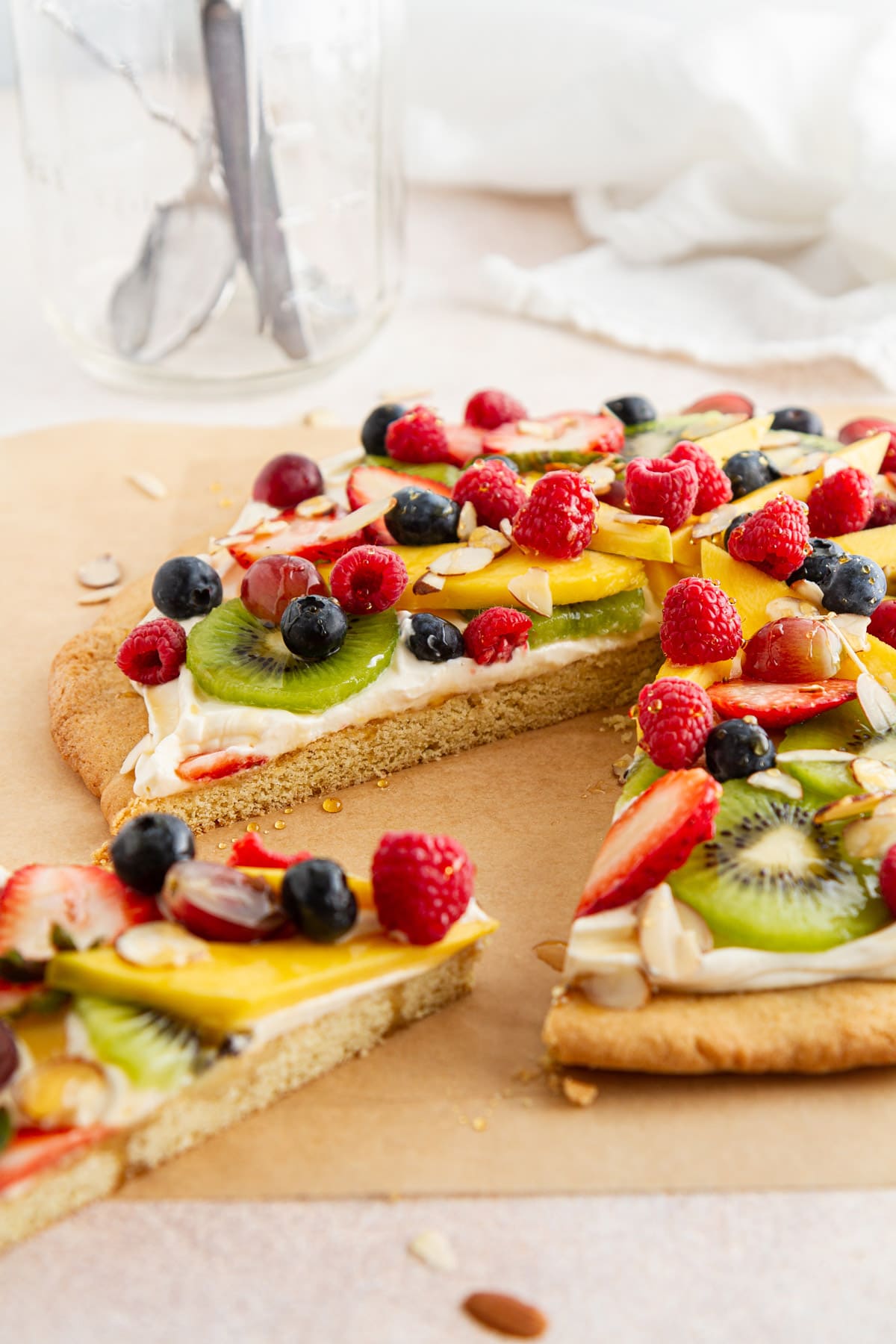 fruit pizza on parchment paper.