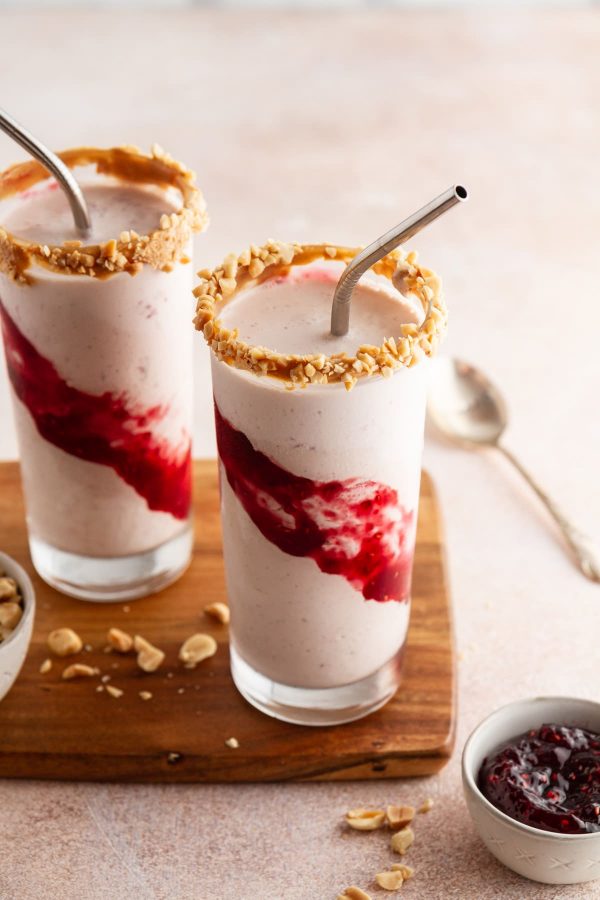 peanut butter and jelly milkshakes on a cutting board