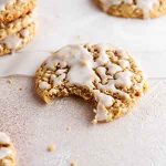 bite taken out of iced pumpkin spice oatmeal cookies