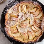 German apple pancake in a cast-iron skillet.