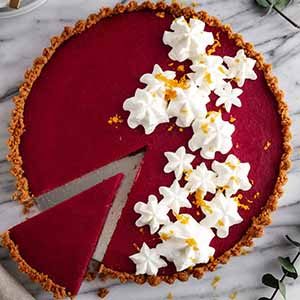 overhead shot of cranberry gingersnap tart on a surface.