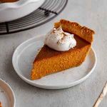 pumpkin pie slice on a plate.