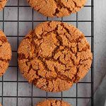 molasses cookies on a cooling rack.