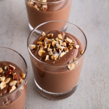 cups of Nutella pudding on a surface.
