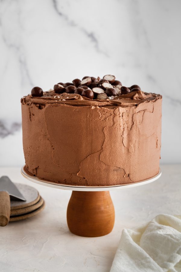 malted chocolate cake on a cake stand