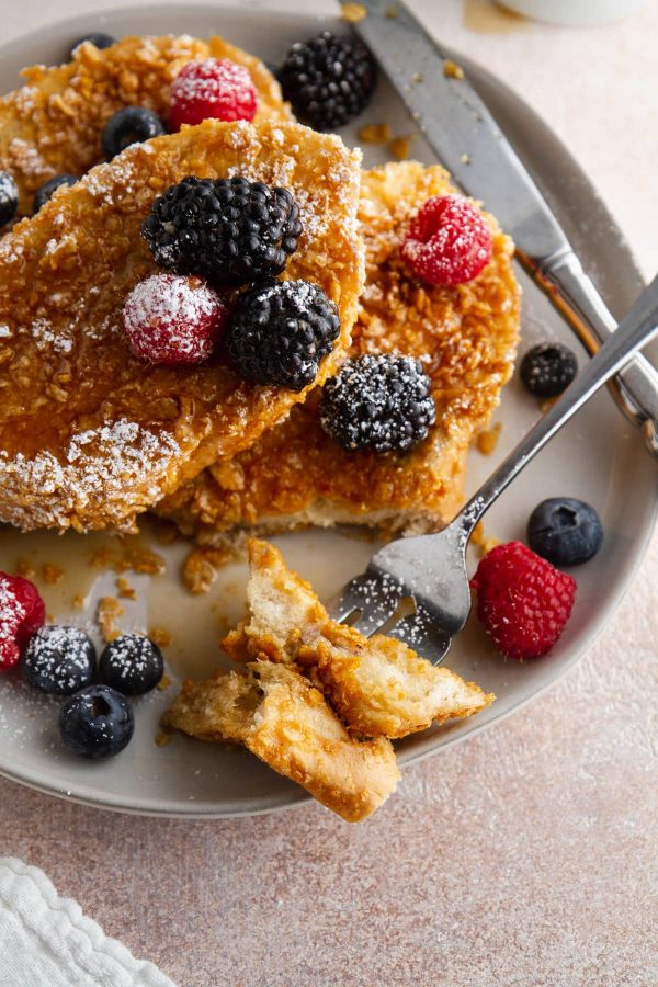 forkful of crunchy French toast on a plate