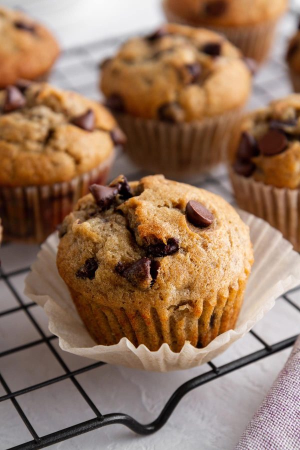 closeup of chocolate chip banana muffin on a cooling rack