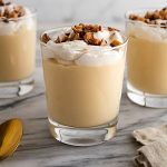 glasses of pudding on a surface