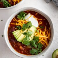 overhead shot of beef and red wine chili in a bowl