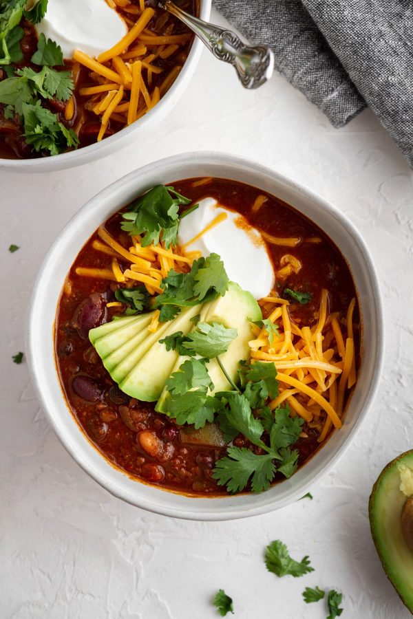 overhead shot of beef and red wine chili in a bowl