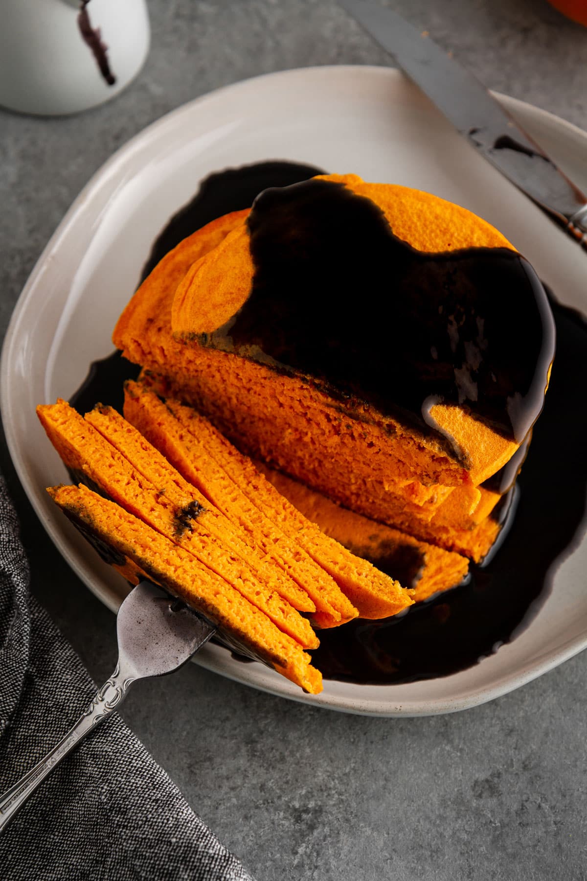 forkful of pancakes on a plate