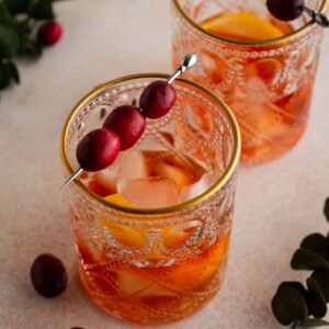 two cocktail glasses on a surface