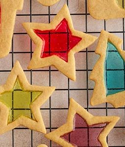 stained glass window cookies on a cooling rack