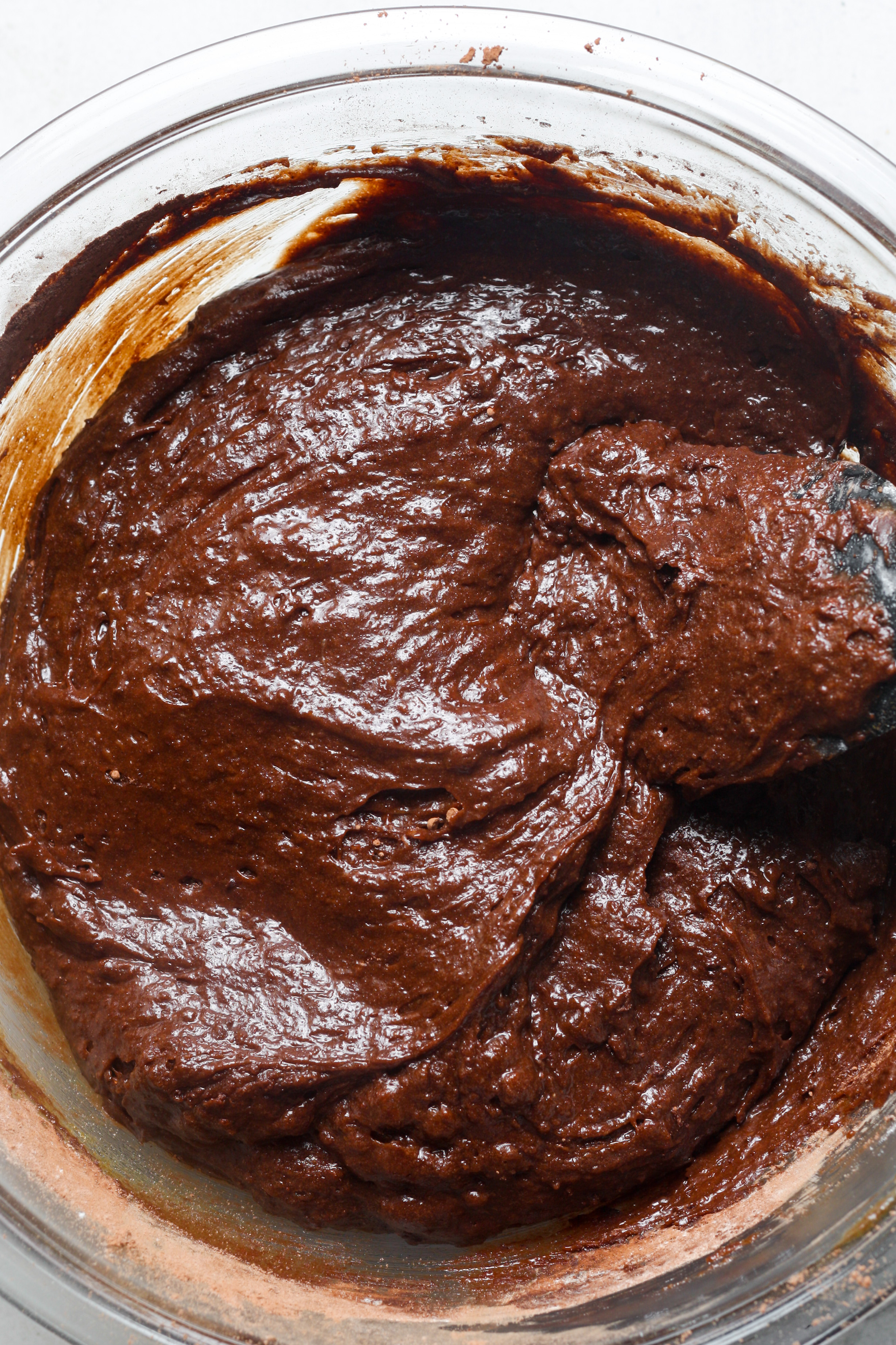 Thick brownie batter in bowl.