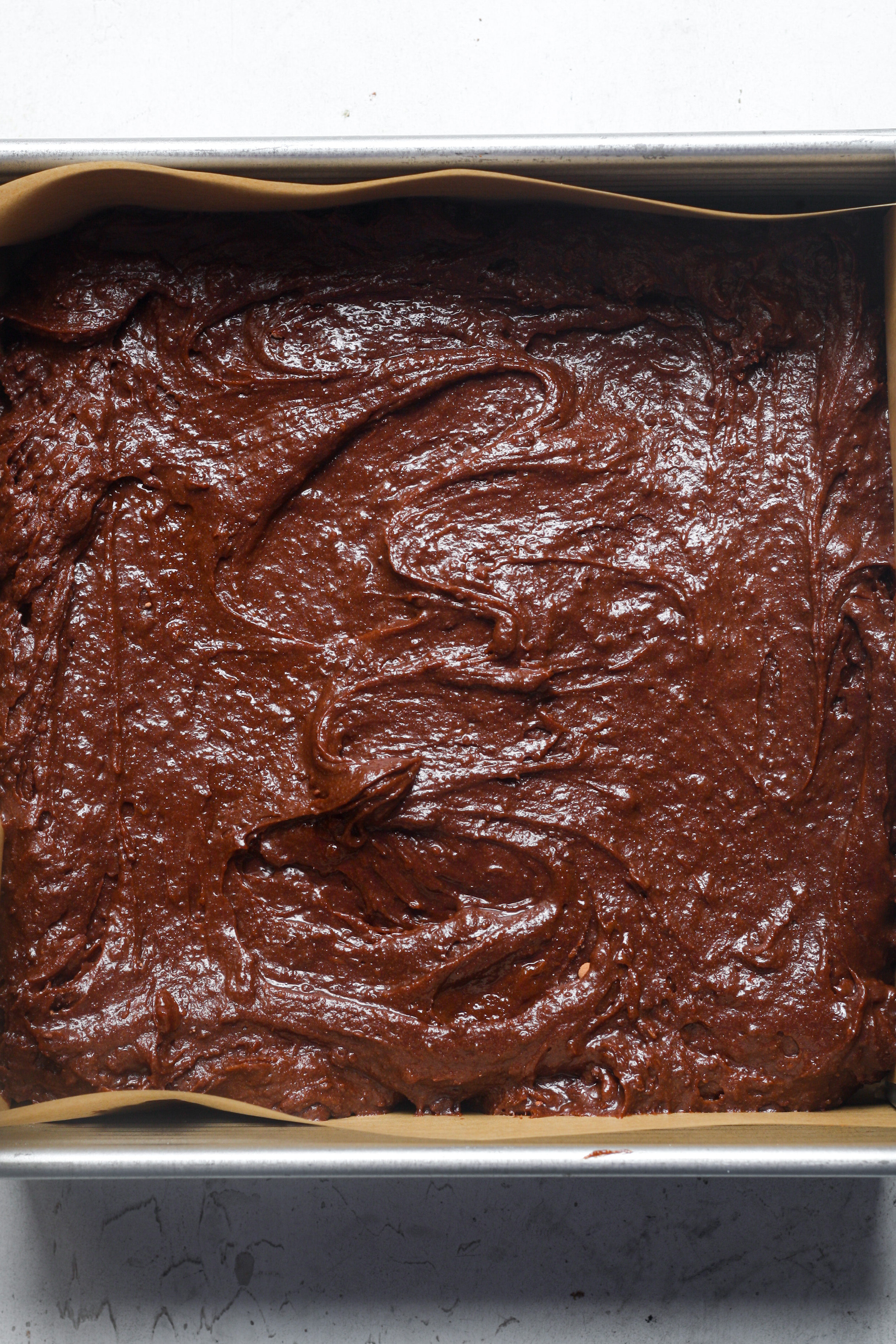 Pan with chocolate batter.
