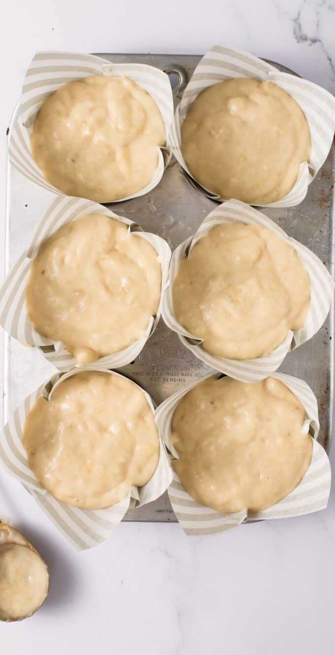 Muffin pan with batter.