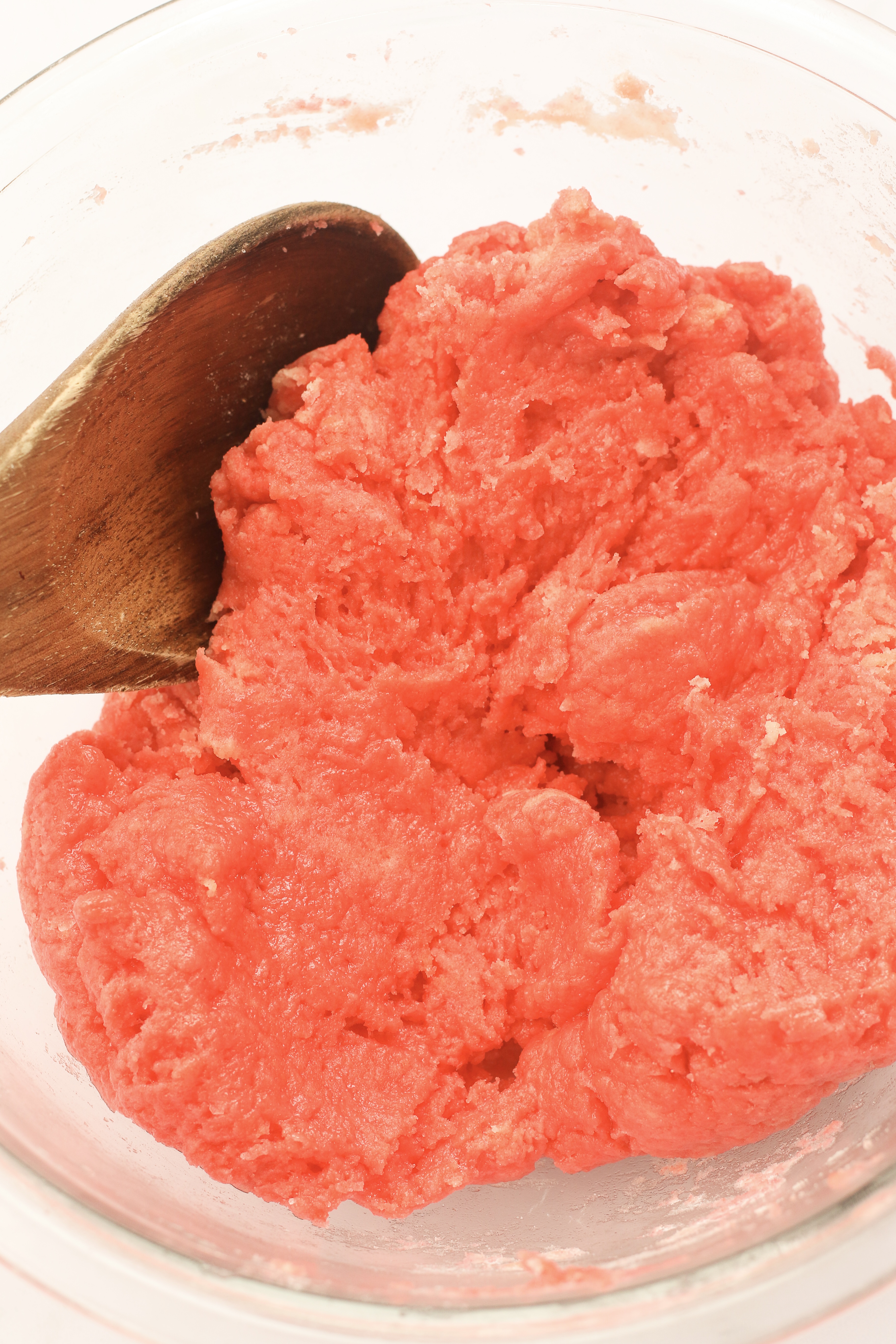 Bowl with pink dough.