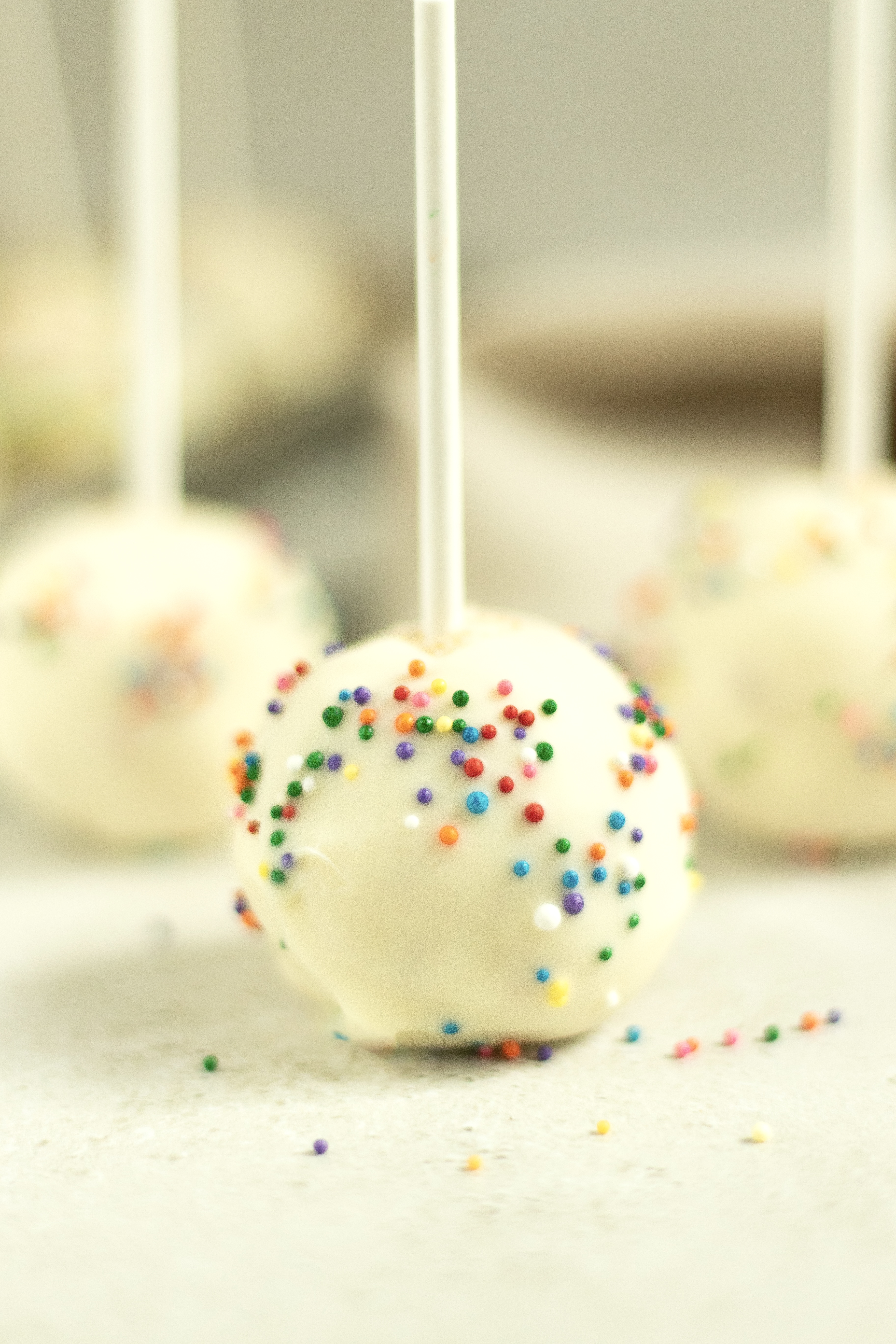 White ball with sprinkles.