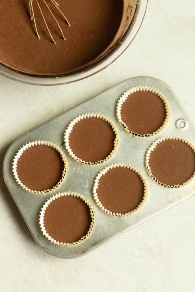 Chocolate batter in cupcake pan.