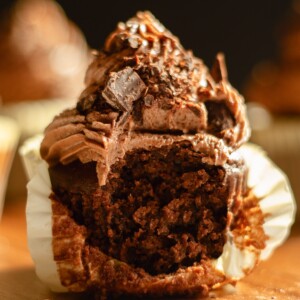 soft chocolate cupcake with chocolate buttercream unwrapped.