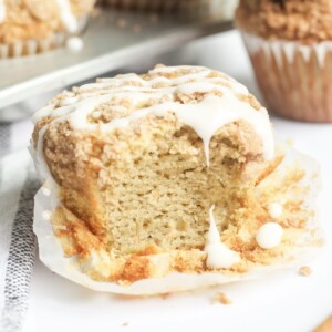coffee cake muffin unwrapped and sliced open.