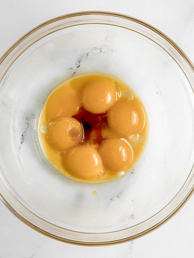 Eggs and vanilla in bowl.
