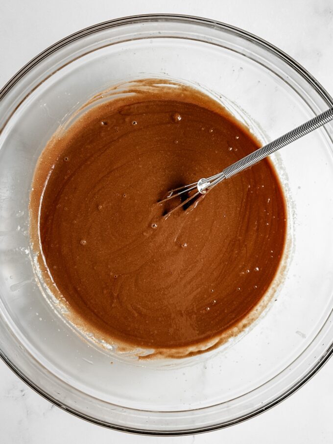 Whisked chocolate in bowl.