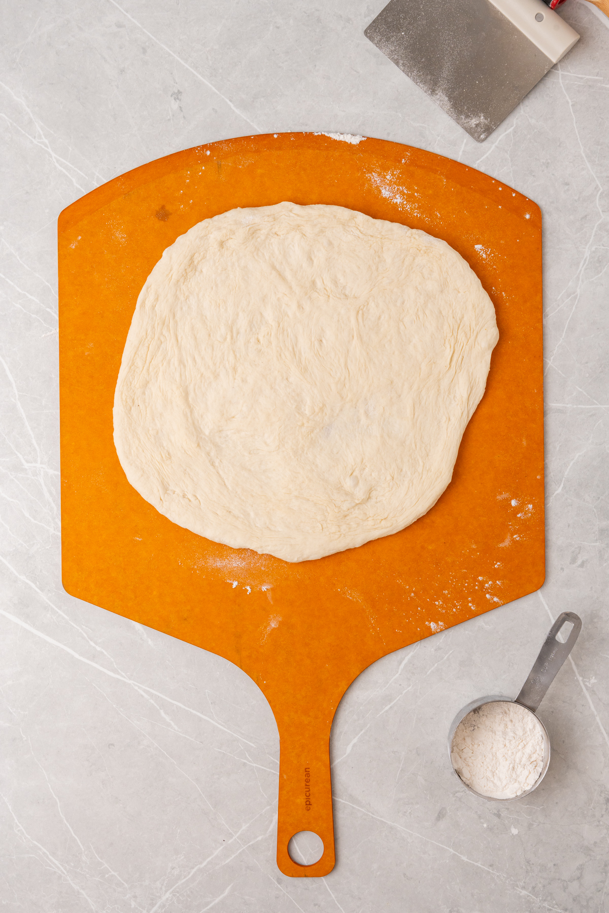 Dough on pizza pan.