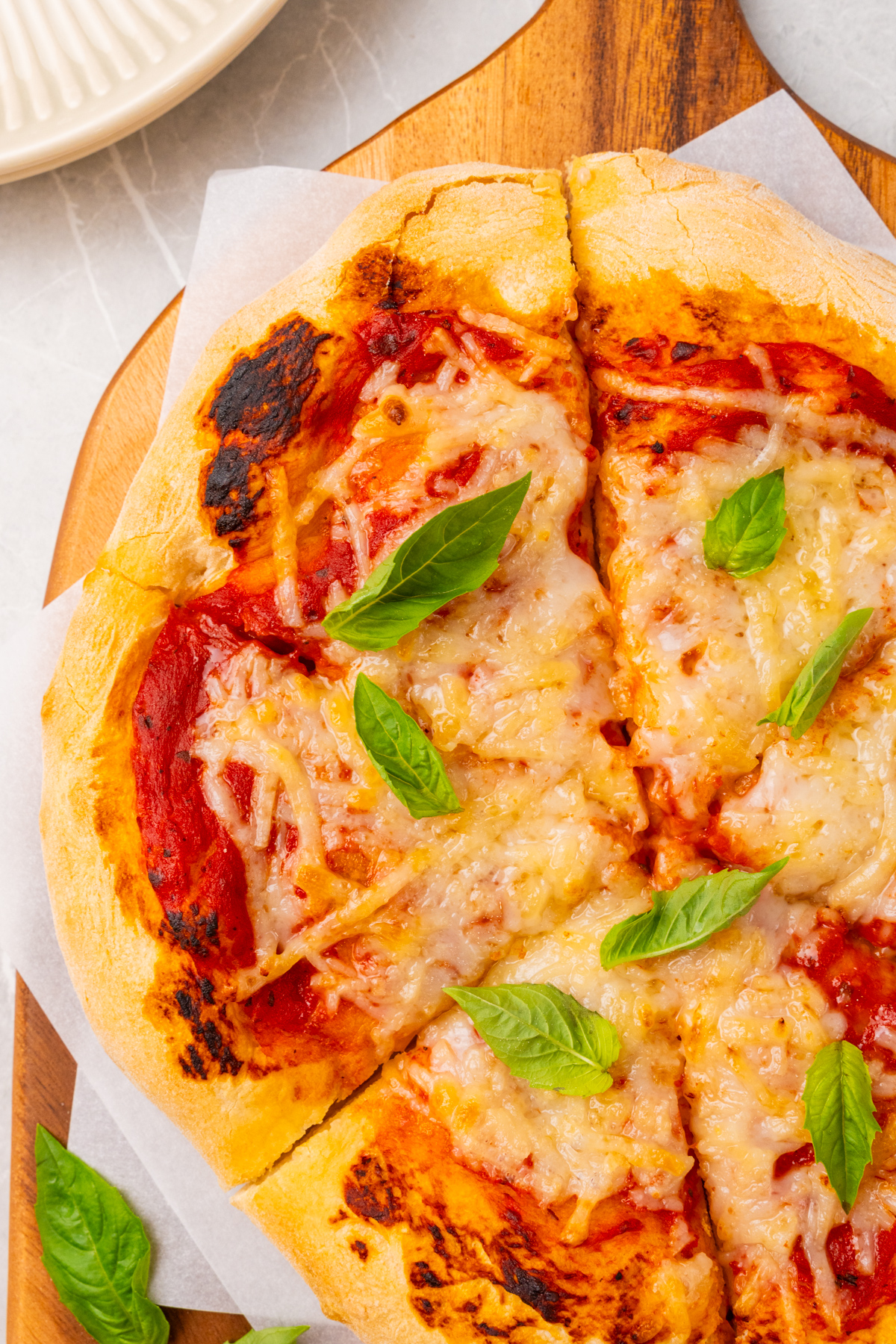 Cheese pizza with basil.