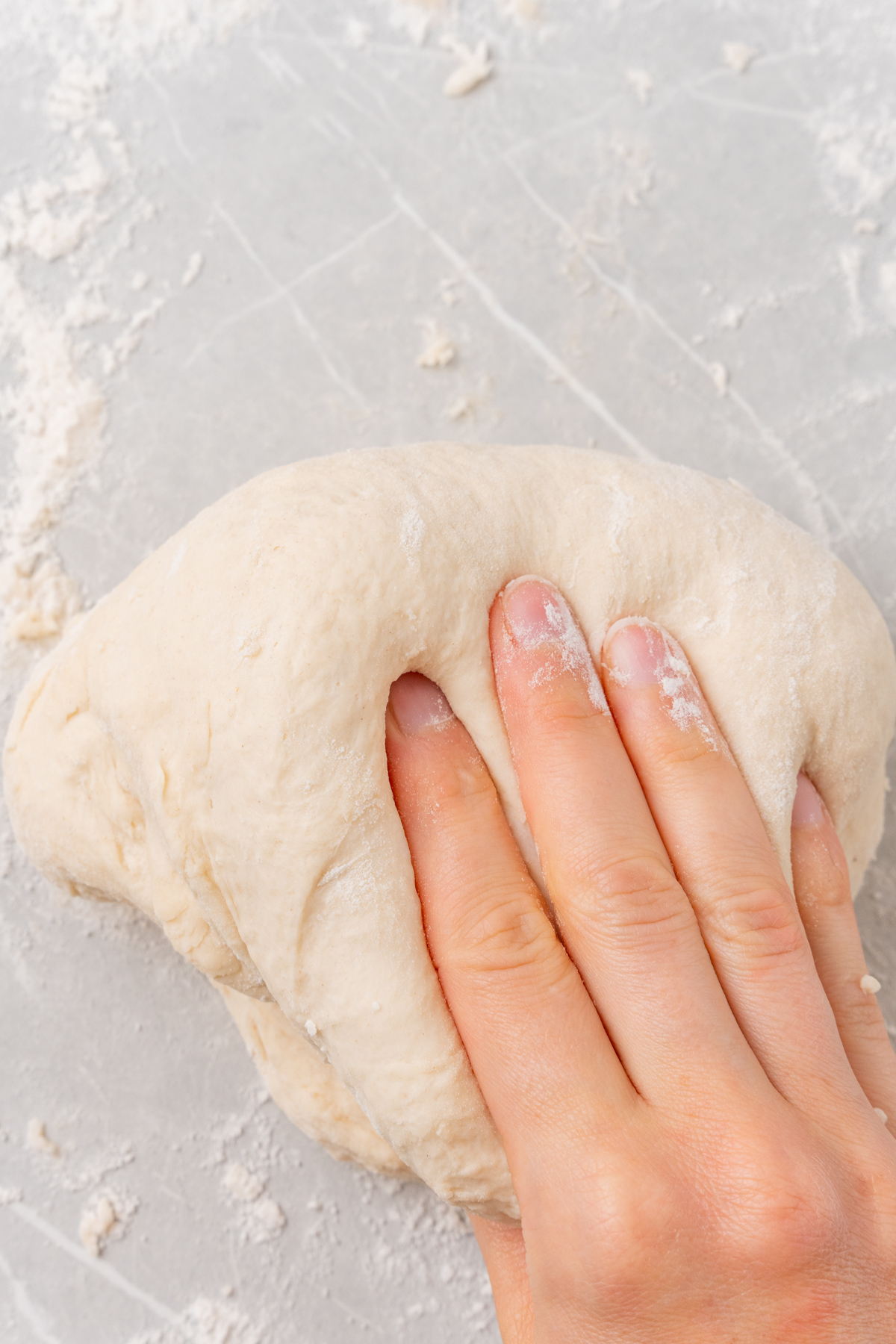 Kneading pizza dough.