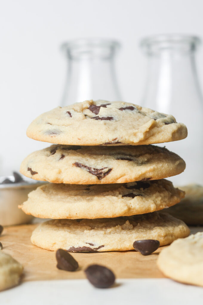 Stack of gooey chocolate chip cookies.