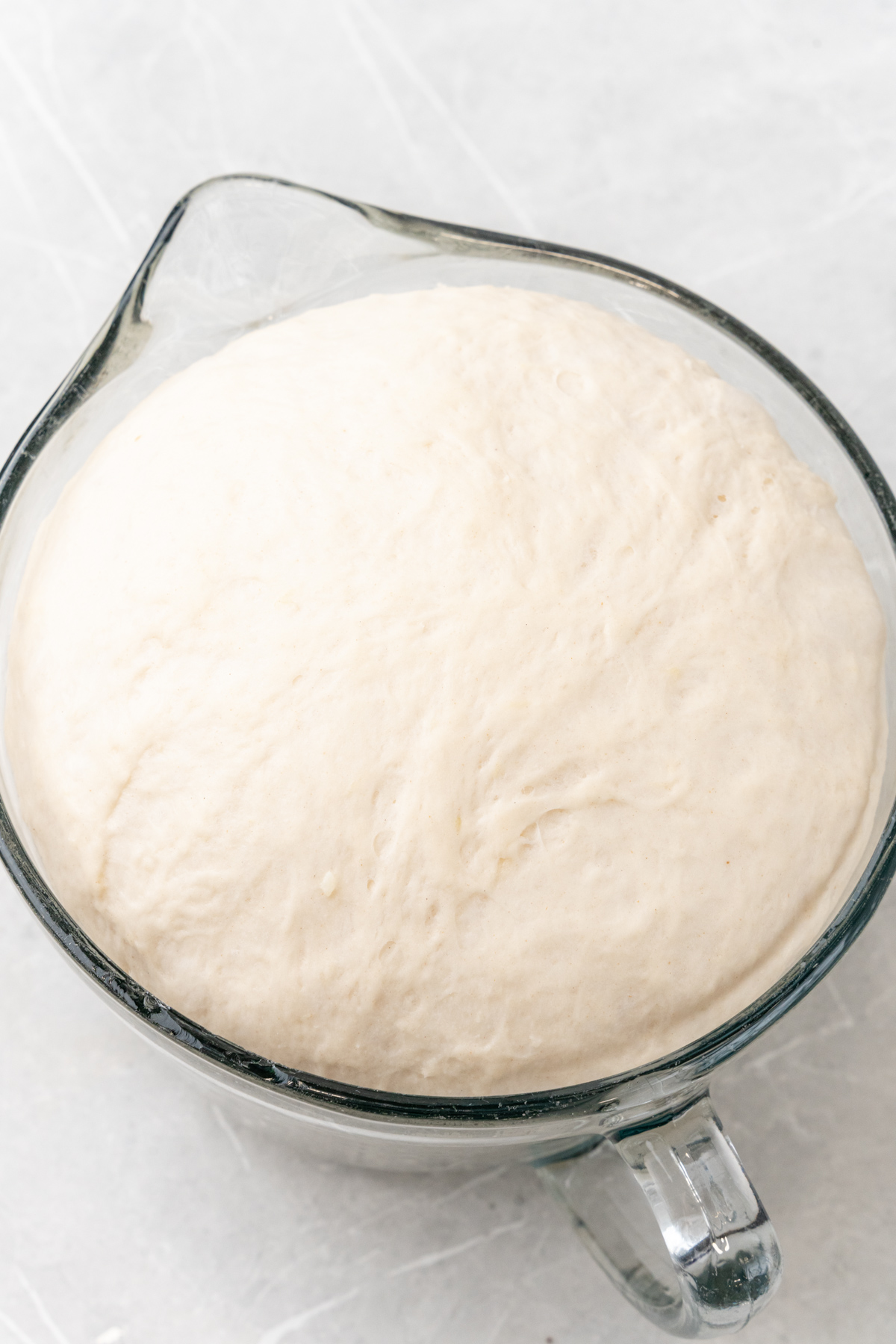 Mixing bowl with fluffy dough.