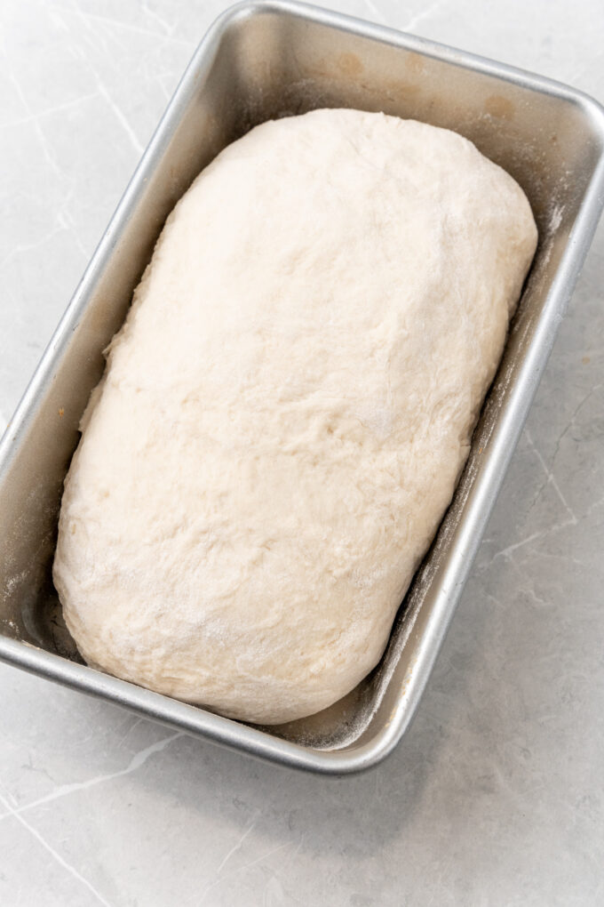 Dough in loaf pan.