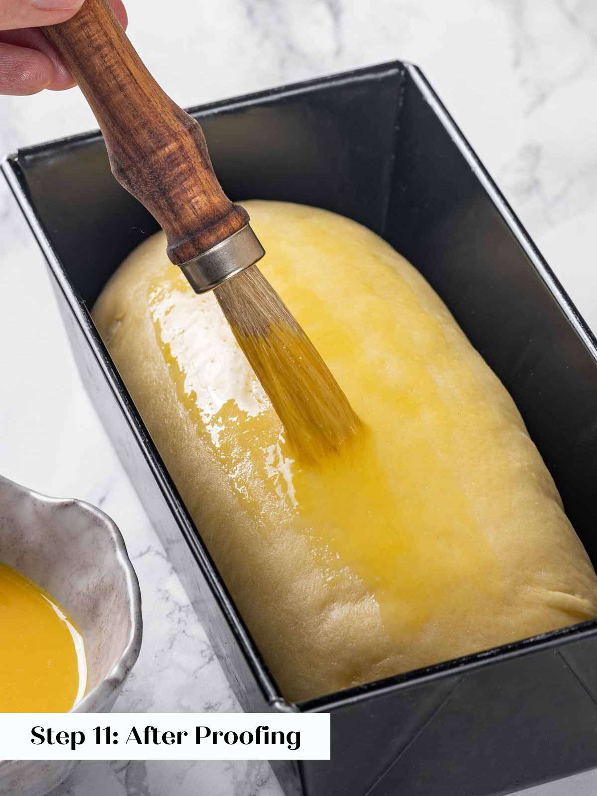 egg washing proofed brioche dough.