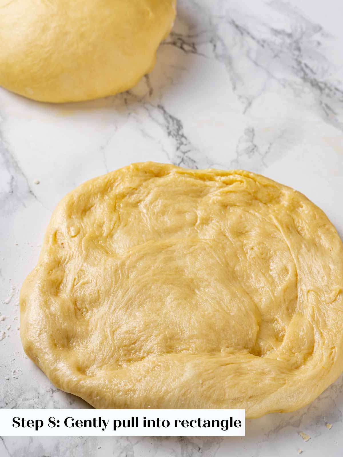 shaping brioche into square before folding.
