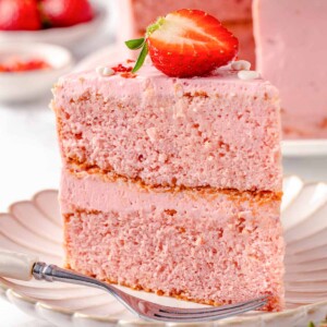 slice of strawberry cake on white plate.