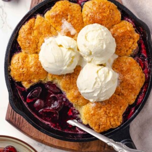 Cherry cobbler in a cast iron skillet.