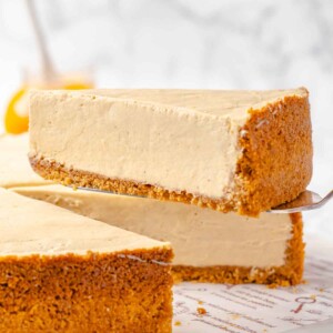 A slice of pumpkin no-bake cheesecake on a cake server.