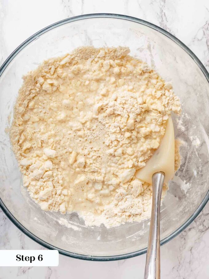 adding vodka and water to pie crust.