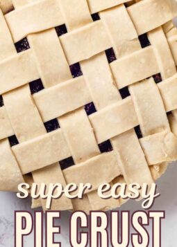 latticed pie crust unbaked on pie with text overlay.