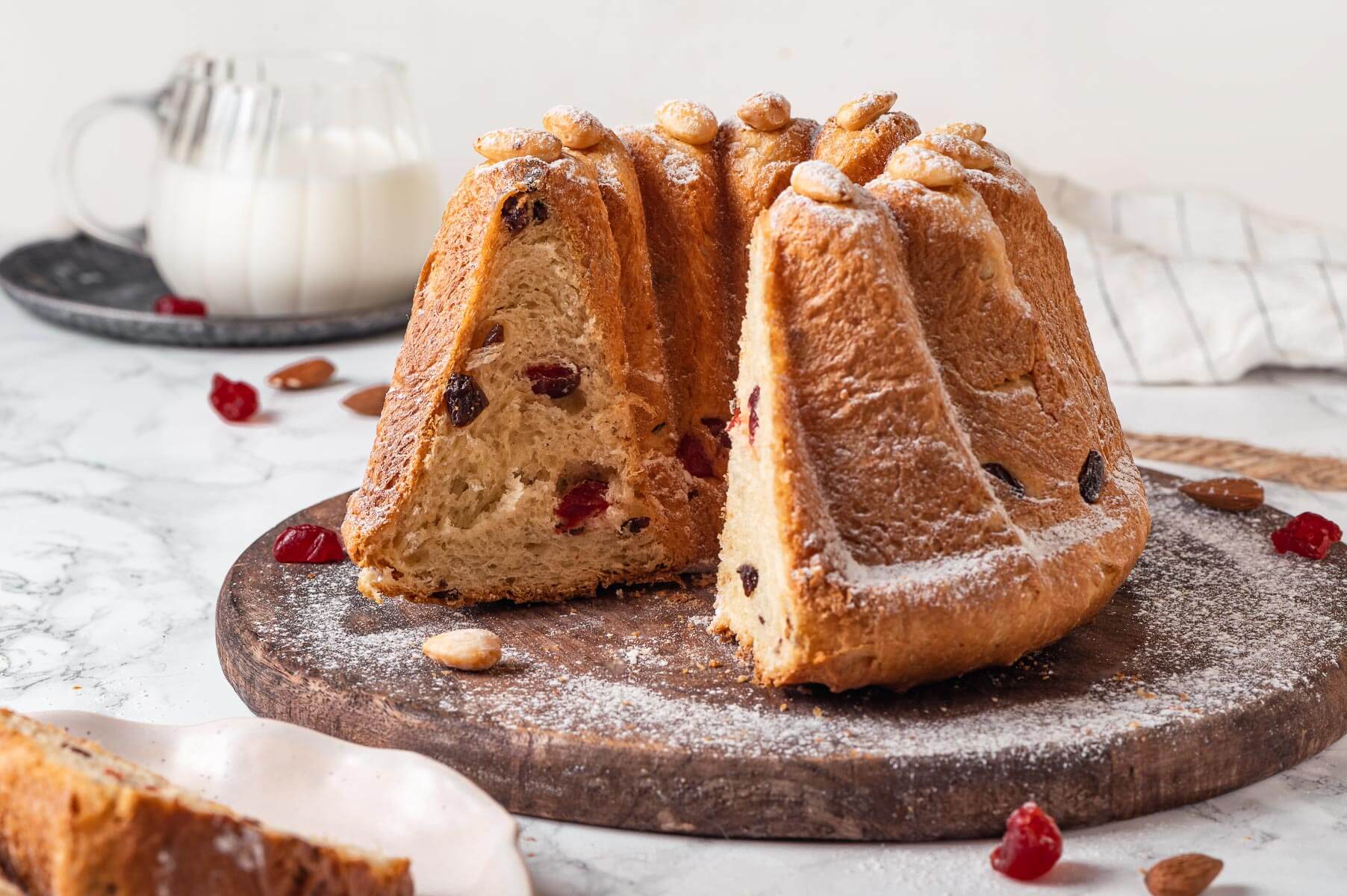 kugelhopf on a marble counter with a slice removed.